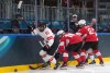 Canada’s Sarah Fillier (10) battles for the puck with Switzerland’s Nicole Vallario (16) and Annic Buchi (2) during the first period of a preliminary round women's hockey game at the Milan Cortina Winter Olympics, in Milan, on Saturday, Feb. 7, 2026. THE CANADIAN PRESS/Darryl Dyck