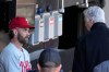 FILE - Philadelphia Phillies' Bryce Harper, left, listens to club President David Dombrowski, after Harper's workout before game one of a baseball double header against the Chicago White Sox, April 18, 2023, in Chicago. (AP Photo/Charles Rex Arbogast, file)