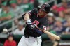 FILE - Cleveland Guardians' Will Brennan follows through with his swing against the Cincinnati Reds during the second inning of a spring training baseball game on March 17, 2025, in Goodyear, Ariz. (AP Photo/Ross D. Franklin, File)