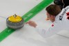 Canada's Marc Kennedy delivers the stone during a men's curling round-robin match against China at the 2026 Winter Olympics in Cortina d'Ampezzo, Italy on Feb. 15, 2026. (AP Photo/David J. Phillip)