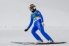 Abigail Strate, of Canada, brakes in the finish area after her final round jump of the ski jumping women's large hill individual at the 2026 Winter Olympics, in Predazzo, Italy, Sunday, Feb. 15, 2026. (AP Photo/Matthias Schrader)