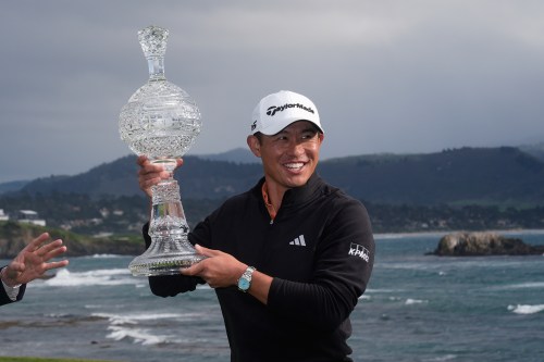 Collin Morikawa celebrates at Pebble Beach Golf Links after winning the AT&T Pebble Beach Pro-Am golf tournament in Pebble Beach, Calif., Sunday, Feb. 15, 2026. (AP Photo/Godofredo A. Vásquez)