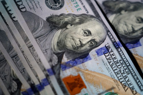 FILE - The likeness of Benjamin Franklin is seen on U.S. $100 bills, Thursday, July 14, 2022, in Marple Township, Pa. (AP Photo/Matt Slocum, File)