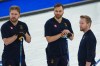 Sweden's Niklas Edin, Oskar Eriksson, and Rasmus Wranaa look on during the men's curling round robin session against Germany, at the 2026 Winter Olympics, in Cortina d'Ampezzo, Italy, Monday, Feb. 16, 2026. (AP Photo/Misper Apawu)
