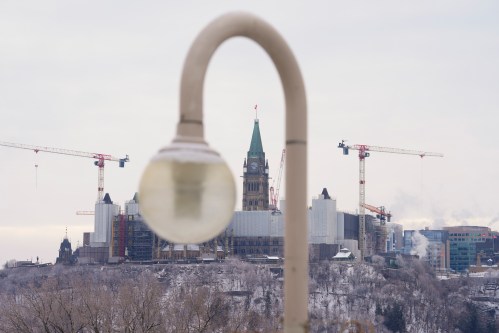 The Peace Tower on Parliament Hill in Ottawa is pictured from Gatineau, Que., on Tuesday, Dec. 9, 2025. THE CANADIAN PRESS/Sean Kilpatrick