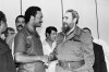FILE - Democratic Presidential candidate Rev. Jesse Jackson and Cuban President Fidel Castro shake hands following a post-midnight news conference in Havana, Cuba, where the two leaders outlined a plan for improving relations between the U.S. and Cuba, June 7, 1984. (AP Photo/J. Scott Applewhite, File)