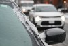 Ice covers the windscreen of a car in Montreal, Monday, Dec. 29, 2025, following a storm which dumped around 15 millimetres of freezing rain in the area. THE CANADIAN PRESS/Graham Hughes