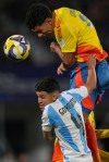 Colombia's Emilio Aristizabal heads the ball over Argentina's Dylan Gorosito during a FIFA U-20 World Cup semifinal soccer match at National Stadium in Santiago, Chile, Wednesday, Oct. 15, 2025. (AP Photo/Esteban Felix)