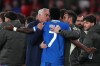 Real Madrid's Vinicius Junior argues with Benfica's head coach José Mourinho after scoring the opening goal during a Champions League playoff soccer match between SL Benfica and Real Madrid in Lisbon, Portugal, Tuesday, Feb. 17, 2026. (AP Photo/Pedro Rocha)