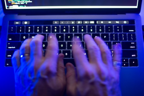 A person uses a computer keyboard in Toronto on Monday, Oct. 9, 2023 in this photo illustration. THE CANADIAN PRESS/Graeme Roy