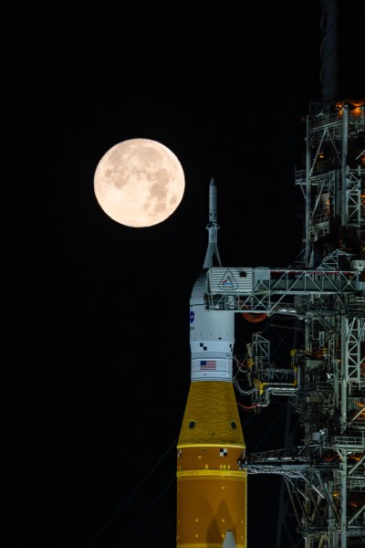 This photo provided by NASA shows a full moon shining over NASA’s Space Launch System and Orion spacecraft, atop the mobile launcher at Launch Pad 39B at the Kennedy Space Center in Florida, on Feb. 1, 2026. (Sam Lott/NASA via AP)