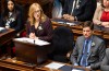 B.C. Minister of Finance Brenda Bailey tables the provincial budget as Premier David Eby, right, looks on in the assembly at legislature in Victoria, on Tuesday, Feb. 17, 2026. THE CANADIAN PRESS/Chad Hipolito