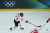 Canada’s Natalie Spooner (24) takes a shot on goal against Switzerland during the third period of a preliminary round women's hockey game at the Milan Cortina Winter Olympics, in Milan, on Saturday, Feb. 7, 2026. THE CANADIAN PRESS/Darryl Dyck
