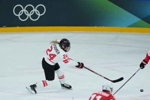 Canada’s Natalie Spooner (24) takes a shot on goal against Switzerland during the third period of a preliminary round women's hockey game at the Milan Cortina Winter Olympics, in Milan, on Saturday, Feb. 7, 2026. THE CANADIAN PRESS/Darryl Dyck