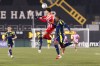 Atletico Ottawa's Ralph Khoury (19) tries to control a ball with pressure from Nashville SC's Thomas Williams (21) during round one of the 2026 CONCACAF Champions Cup in Hamilton, Tuesday, Feb. 17, 2026. THE CANADIAN PRESS/Nick Iwanyshyn