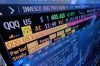 A screen on the floor of the New York Stock Exchange displays an intraday number for the QQQ, tracking the Nasdaq-100, Friday, Feb. 13, 2026. (AP Photo/Richard Drew)
