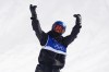 China's Su Yiming celebrates during the men's snowboarding slopestyle finals at the 2026 Winter Olympics, in Livigno, Italy, Wednesday, Feb. 18, 2026. (AP Photo/Rebecca Blackwell)