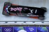 United States' Kaysha Love, left, slides down the track during a two women bobsled training session at the 2026 Winter Olympics, in Cortina d'Ampezzo, Italy, Tuesday, Feb. 17, 2026. (AP Photo/Alessandra Tarantino)Canada's Melissa Lotholz