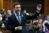 Conservative MP for Edmonton Riverbend Matt Jeneroux rises during Question Period, Monday, Dec. 6, 2021 in Ottawa. THE CANADIAN PRESS/Adrian Wyld