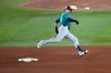 FILE - Seattle Mariners' Mitch Garver runs out a pinch hit triple against the Toronto Blue Jays during the sixth inning in Game 2 of baseball's American League Championship Series, Oct. 13, 2025, in Toronto. (AP Photo/David J. Phillip, File)