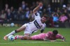 Vancouver Whitecaps' Thomas Muller (top) is taken down by Inter Miami's Rodrigo de Paul (7) during the first half of the MLS Cup final soccer match, in Fort Lauderdale, Fla., on Saturday, December 6, 2025. THE CANADIAN PRESS/Darryl Dyck