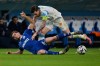 Strasbourg's Ben Chilwell, bottom, and Marseille's Pierre-Emile Hojbjerg vie for the ball during the French League One soccer match between Marseille and Strasbourg in Marseille, France, Saturday, Feb. 14, 2026. (AP Photo/Philippe Magoni)