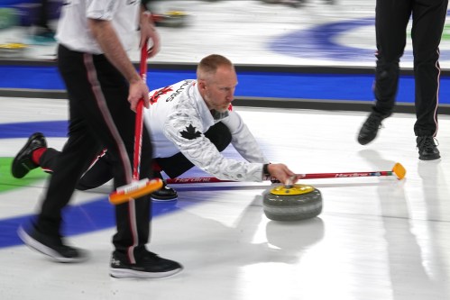 Canada's Brad Jacobs in action during the men's curling round robin session against Norway at the 2026 Winter Olympics, in Cortina d'Ampezzo, Italy, Thursday, Feb. 19, 2026. (AP Photo/Fatima Shbair)