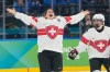 Switzerland's Alina Muller (25) celebrates after a women's ice hockey bronze medal game between Switzerland and Sweden at the 2026 Winter Olympics, in Milan, Italy, Thursday, Feb. 19, 2026. (AP Photo/Hassan Ammar)