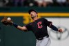FILE - Cleveland Guardians left fielder Steven Kwan reaches out to catch a fly out during a baseball game against the Texas Rangers, Aug. 23, 2025, in Arlington, Texas. (AP Photo/Tony Gutierrez, File)