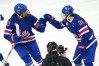 United States' Hilary Knight (21) celebrates with Laila Edwards (10) after Knight deflected a shot by Edwards for a goal against Canada during the third period of the women's ice hockey gold medal game at the 2026 Winter Olympics, in Milan, Italy, Thursday, Feb. 19, 2026. (AP Photo/Carolyn Kaster)
