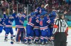United States' players celebrate after a women's ice hockey gold medal game between the United States and Canada at the 2026 Winter Olympics, in Milan, Italy, Thursday, Feb. 19, 2026. (AP Photo/Petr David Josek)