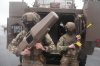 French soldiers holds a soft-kill counter-drone gun during the Orion 2026 military exercises at Saint-Nazaire's airport, western France, Thursday, Feb. 19, 2026. (AP Photo/Michel Euler)