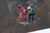 Canada's Marielle Thompson (8), left, and Sweden's Linnea Mobaerg (9) compete during the women's ski cross finals at the 2026 Winter Olympics, in Livigno, Italy, Friday, Feb. 20, 2026. (AP Photo/Gabriele Facciotti)
