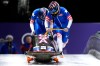 United States' Kaillie Armbruster Humphries, right, and Jasmine Jones start for a two women bobsled run at the 2026 Winter Olympics, in Cortina d'Ampezzo, Italy, Friday, Feb. 20, 2026. (AP Photo/Aijaz Rahi)