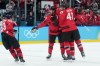 Canada defenceman Shea Theodore (27) celebrates his goal against Finland with Canada defenceman Travis Sanheim (6), Canada forward Tom Wilson (43) and Canada forward Brad Marchand (63) during third period men's Olympic semifinal hockey action at the 2026 Milan Cortina Winter Olympics in Milan, Italy on Friday, Feb. 20, 2026. THE CANADIAN PRESS/Nathan Denette