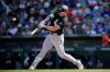 Chicago White Sox's Munetaka Murakami, of Japan, connects for a two-run double against the Chicago Cubs during the fourth inning of a spring training baseball game Friday, Feb. 20, 2026, in Mesa, Ariz. (AP Photo/Ross D. Franklin)