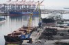 Ships are docked at the Port of Long Beach Friday, Feb. 20, 2026, in Long Beach, Calif. (AP Photo/Damian Dovarganes)
