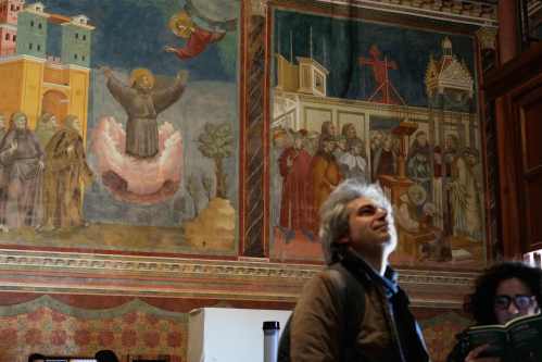 People visit the Basilica of St. Francis with Giotto's frescoes in Assisi, Italy, Saturday, Feb. 21, 2026, on the eve of the public display of St. Francis' remains to mark the 800th anniversary of his death in 1226.(AP Photo/Gregorio Borgia)