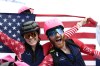 United States' Anna Gibson, left, and United States' Cameron Smith celebrate at the finish area of a ski mountaineering mixed relay, at the 2026 Winter Olympics, in Bormio, Italy, Saturday, Feb. 21, 2026. (AP Photo/Gabriele Facciotti)