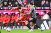 Bayern Munich's Alphonso Davies, left, and Frankfurt's Nnamdi Collins in action during the Bundesliga soccer match between Bayern Munich and Eintracht Frankfurt in Munich, Germany, Saturday Feb. 21, 2026. (Harry Langer/dpa via AP)