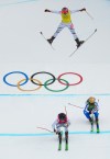 Clock wise from top, Switzerland's Sixtine Cousin (13), France's Jade Grillet Aubert (6) and Switzerland's Talina Gantenbein (5) compete during the women's ski cross finals at the 2026 Winter Olympics, in Livigno, Italy, Friday, Feb. 20, 2026. (AP Photo/Julia Demaree Nikhinson)