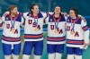 United States' Kyle Connor (81), Zach Werenski (8), Jack Hughes (86) and Clayton Keller (91) react after receiving their gold medals after the United States defeated Canada in the men's ice hockey gold medal game at the 2026 Winter Olympics, in Milan, Italy, Sunday, Feb. 22, 2026. (AP Photo/Luca Bruno)