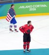 American forward Matthew Tkachuk (19) skates behind Canadian counterpart Connor McDavid (97) after his country won the men's gold-medal hockey game 2-1 in overtime at the Winter Olympics in Milan on Sunday, Feb. 22, 2026. THE CANADIAN PRESS/Darryl Dyck