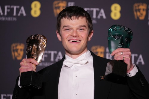 Robert Aramayo poses with the EE rising star award and the award for leading actor for 'I Swear' at the 79th British Academy Film Awards, BAFTA's, in London, Sunday, Feb. 22, 2026. (AP Photo/Alastair Grant)