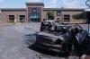 Charred vehicles sit in a parking lot sit outside a shopping mall in Guadalajara, Jalisco state, Mexico, Sunday, Feb. 22, 2026, as authorities reported that the Mexican Army killed Jalisco New Generation Cartel leader Nemesio Oseguera, known as 