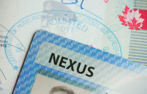 A NEXUS card and a Canadian passport are pictured in Ottawa, Tuesday, Jan. 17, 2023. THE CANADIAN PRESS/Sean Kilpatrick