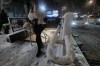 A passenger exits a subway station as snow falls in the Alphabet City neighborhood of New York, Sunday evening, Feb. 22, 2026. (AP Photo/Patrick Sison)