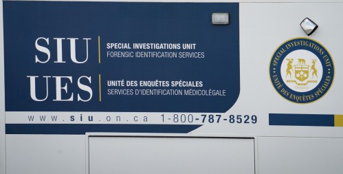 A Special Investigations Unit logo is seen on a truck at Toronto Pearson International Airport, in Mississauga, Ont., on April 24, 2025. THE CANADIAN PRESS/Arlyn McAdorey