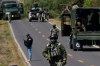 A soldier clears a roadblock on a road leading to Tapalpa, Mexico, Monday, Feb. 23, 2026, a day after the Mexican army killed Jalisco New Generation Cartel leader Nemesio Oseguera Cervantes, known as 