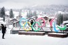 FILE - People take photos in front of the Milan Cortina Winter Olympics and Paralympics rings, in Cortina D'Ampezzo, on Nov. 20, 2025. (AP Photo/Andrew Medichini, File)